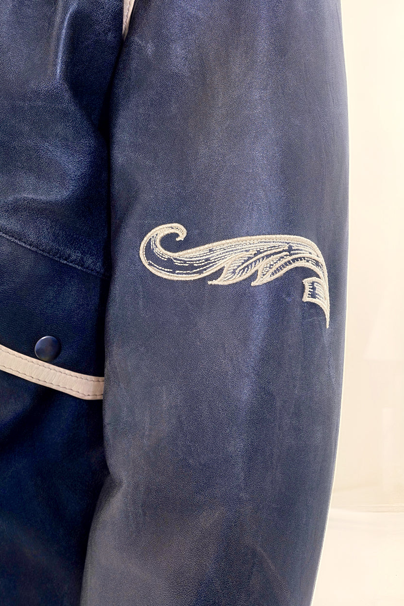 Male model detail shot, wearing our new Icarus style, a vintage-looking weathering grey colour flight jacket, showcasing the sleeve embroidery detail.